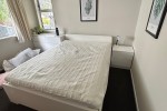 Queen bed, mattress and base, bedside drawers, desk, surf board, Micro...