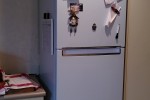 Queen size bed mattress and base, Fridge standing on top of a drawer, ...