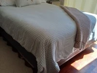 Queen bed, Couch, Small table, Desk