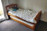 Wooden single bed with trundle and 2 mattresses