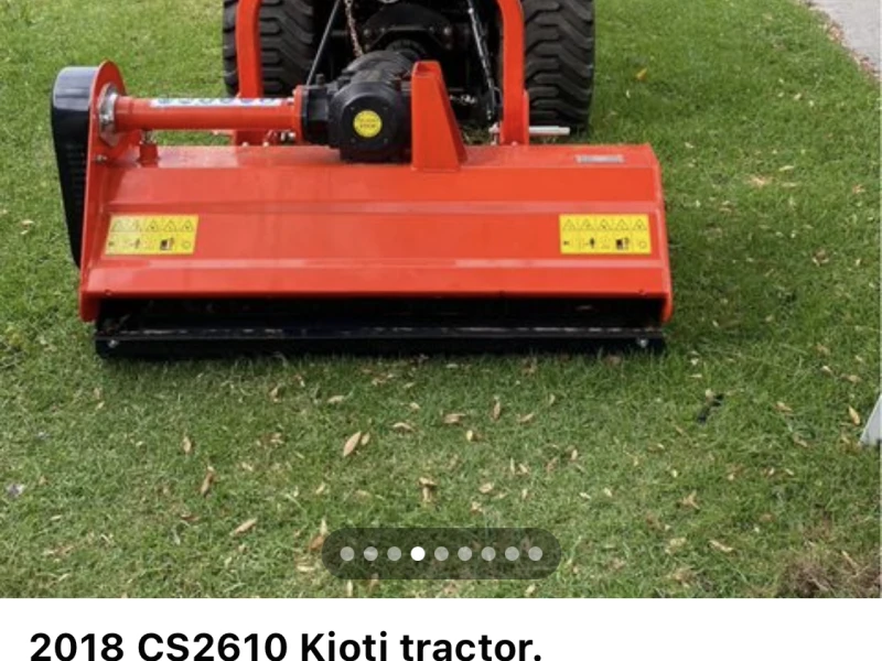 Compact Kioti tractor and mower