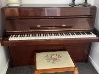 Yamaha upright piano and outdoor table set with four chairs