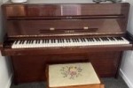 Yamaha upright piano and outdoor table set with four chairs