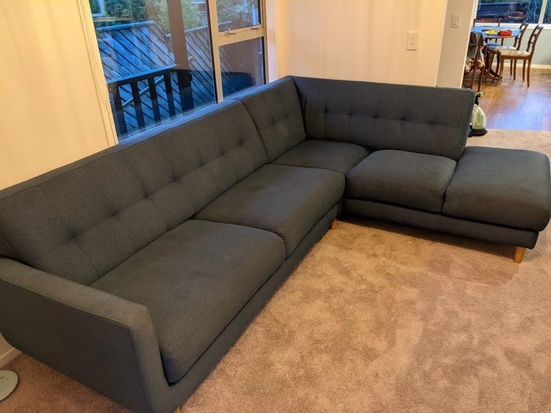 Blue fabric corner L shaped couch with chaise