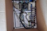 Box of motorbike plastics and one rear suspension