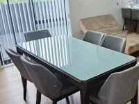 Dinning table with glass top and 6 chairs.