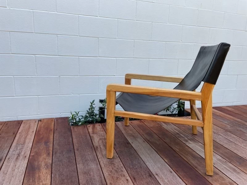 Black leather sling chair with wood frame, Chair