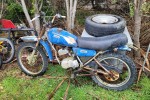 Old rusty 50cc motorbike