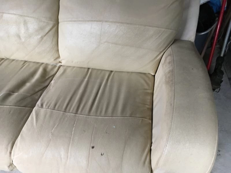 Comfy leather couch with stretch cover