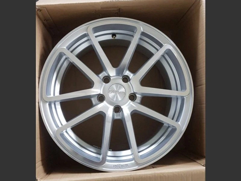 Four alloy car wheels in boxes