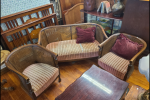 Round Dining table plus six chairs,, 3 piece cane couch 2 chairs and 2...