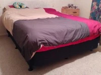 Queen size bed mattress and base, Fridge standing on top of a drawer, ...