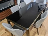 Dinning table with glass top and 6 chairs.