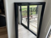Large black framed mirror