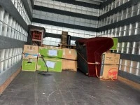 One arm chair, small wooden cabinet, small table, 12-15 medium boxes