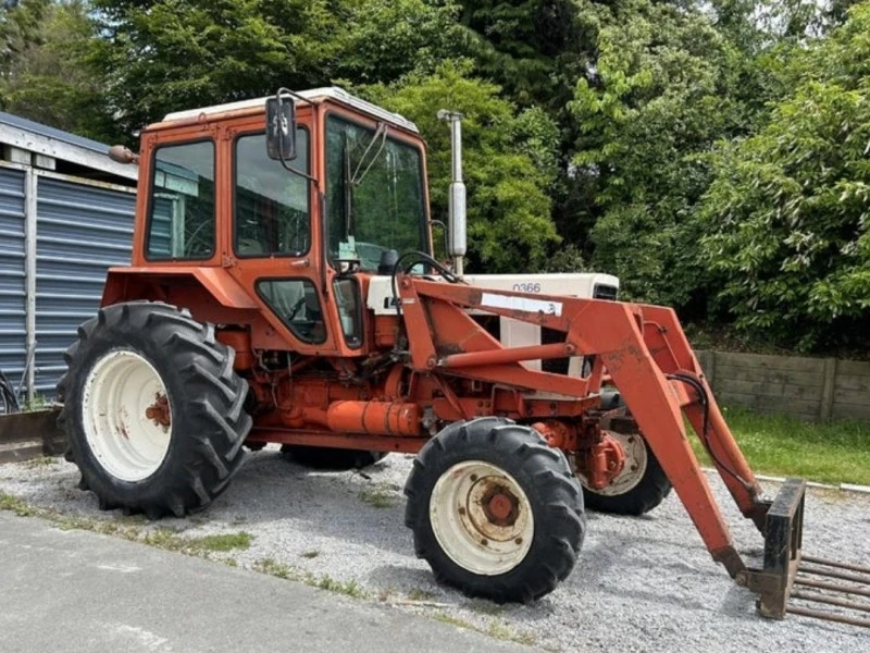 Farm tractor with front loader bucket