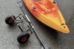 Kayak with paddle and trolley