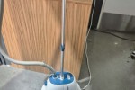 Collapsed cloths rack, small bench seat, clothing steamer, small box