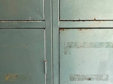 Retro industrial steel locker in metallic green