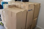 Lounge Chair + Poof, Single door fridge, Boxes of tools, Washer, Dryer