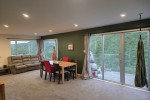 4 single beds, boxes, 3 and 2 seater recliner couch and washing machin...