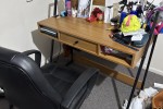 A qeen sized bed, A sofa for two, A desk, A chair, A small dining desk...