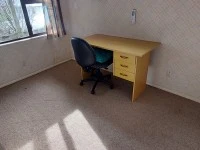 Corner couch, Dining table, Armchair, Desk, Tall cupboard, Bicycle