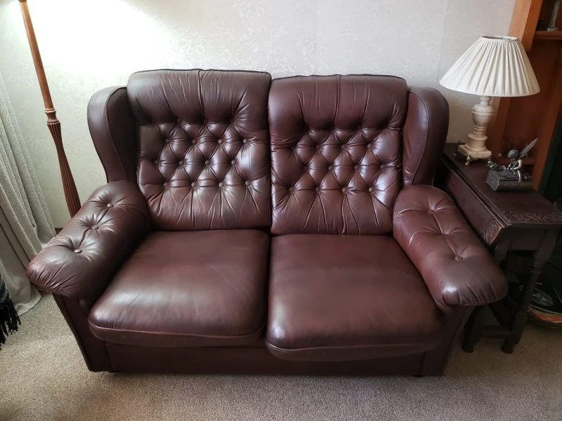 2 x Leather buttoned couches approx 1470 wide x 900 high x 1000 deep