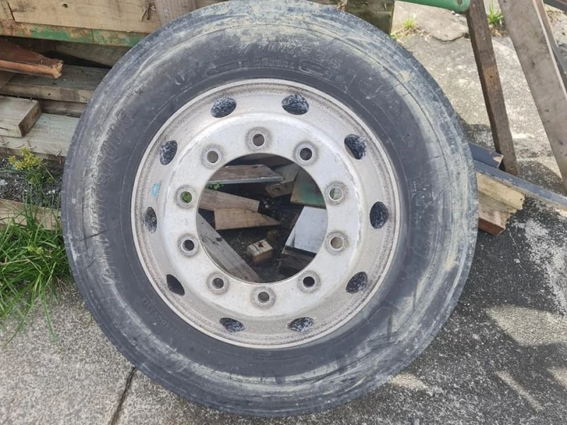 Two aluminum truc rims one with tyre on
