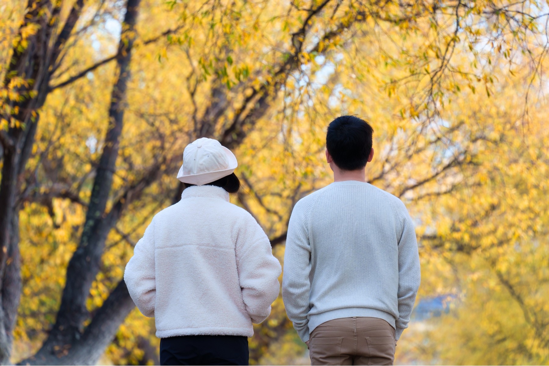 Couple wearing extra layers going into Autumn season in New Zealand