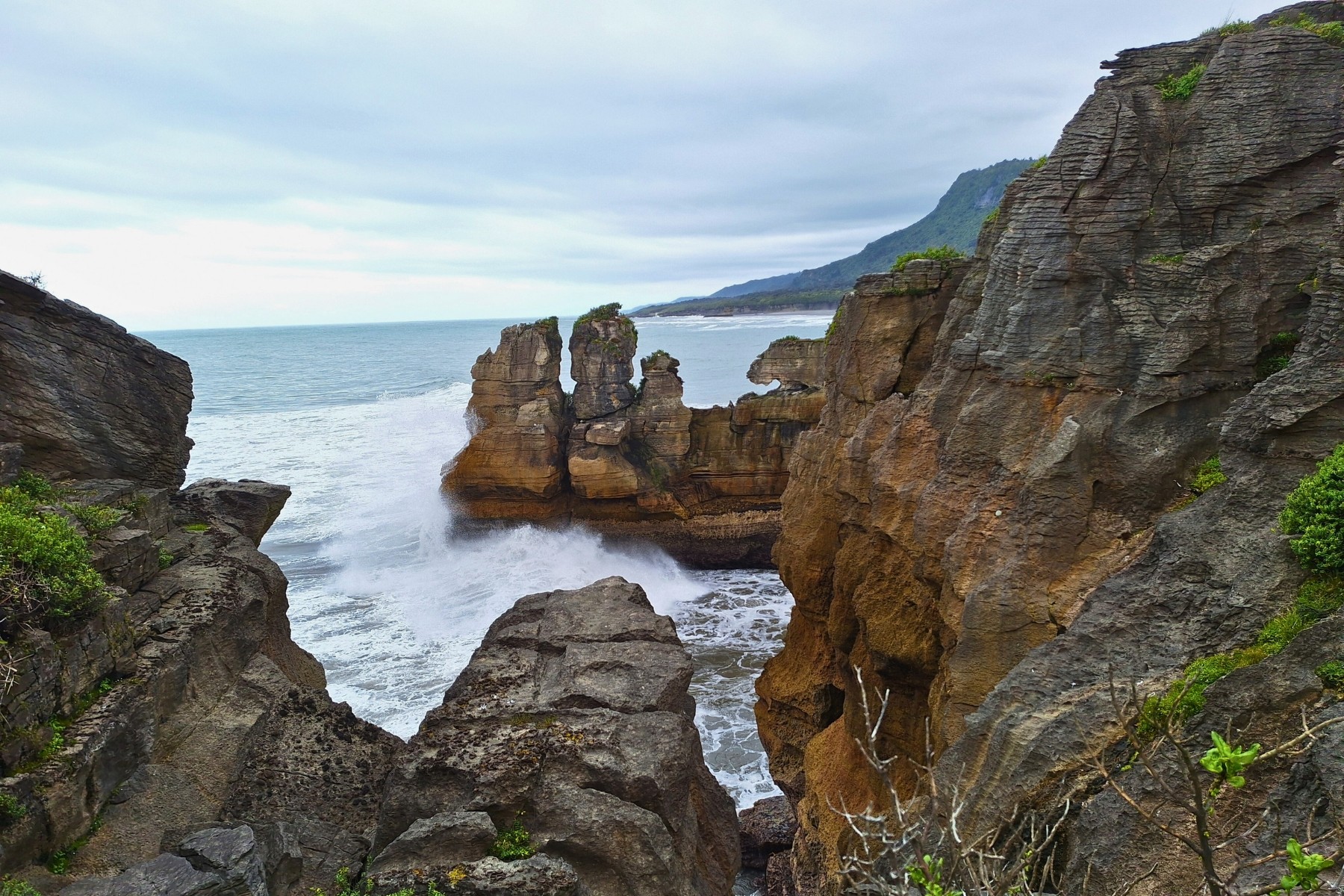 Exploring limestone formations at Punakaiki Rocks
