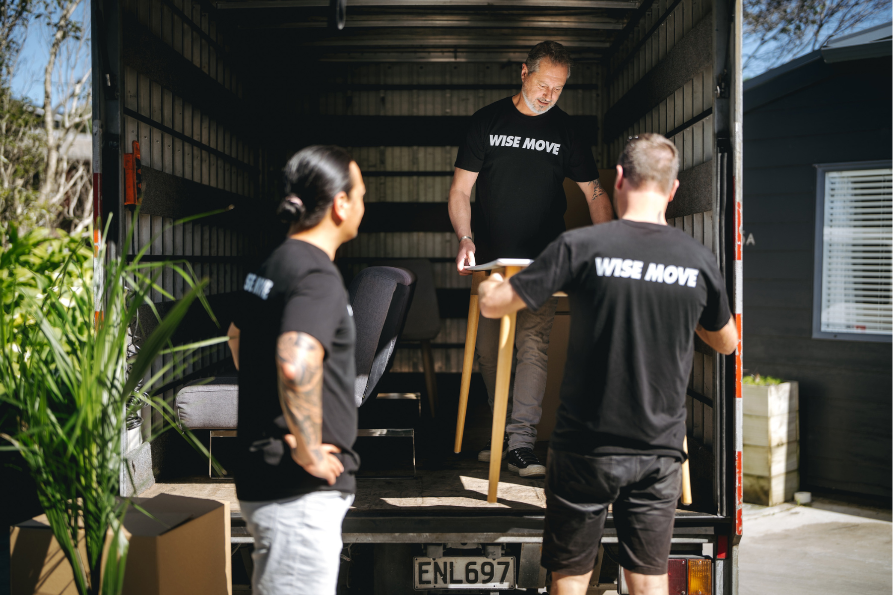 Wise Move moving team loading a desk into a moving truck for an office move