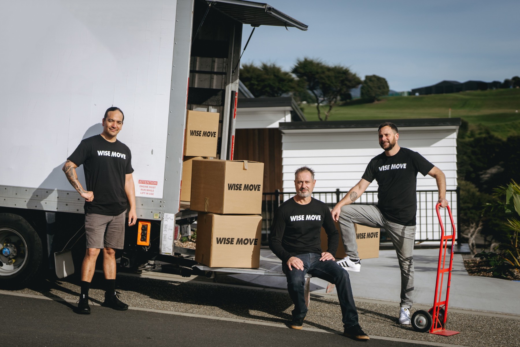 Wise Move moving team standing next to moving truck in Hamilton