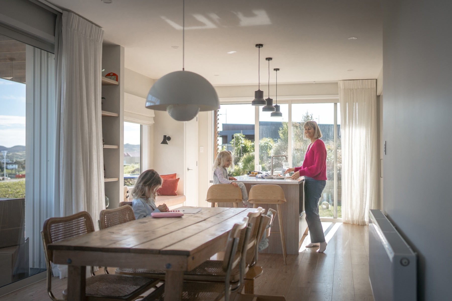 other in kitchen area with children in preparation for Christmas