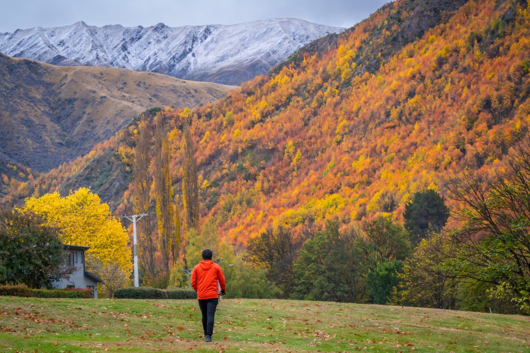 Person dressed for late Autumn weather in South Land, New Zealand