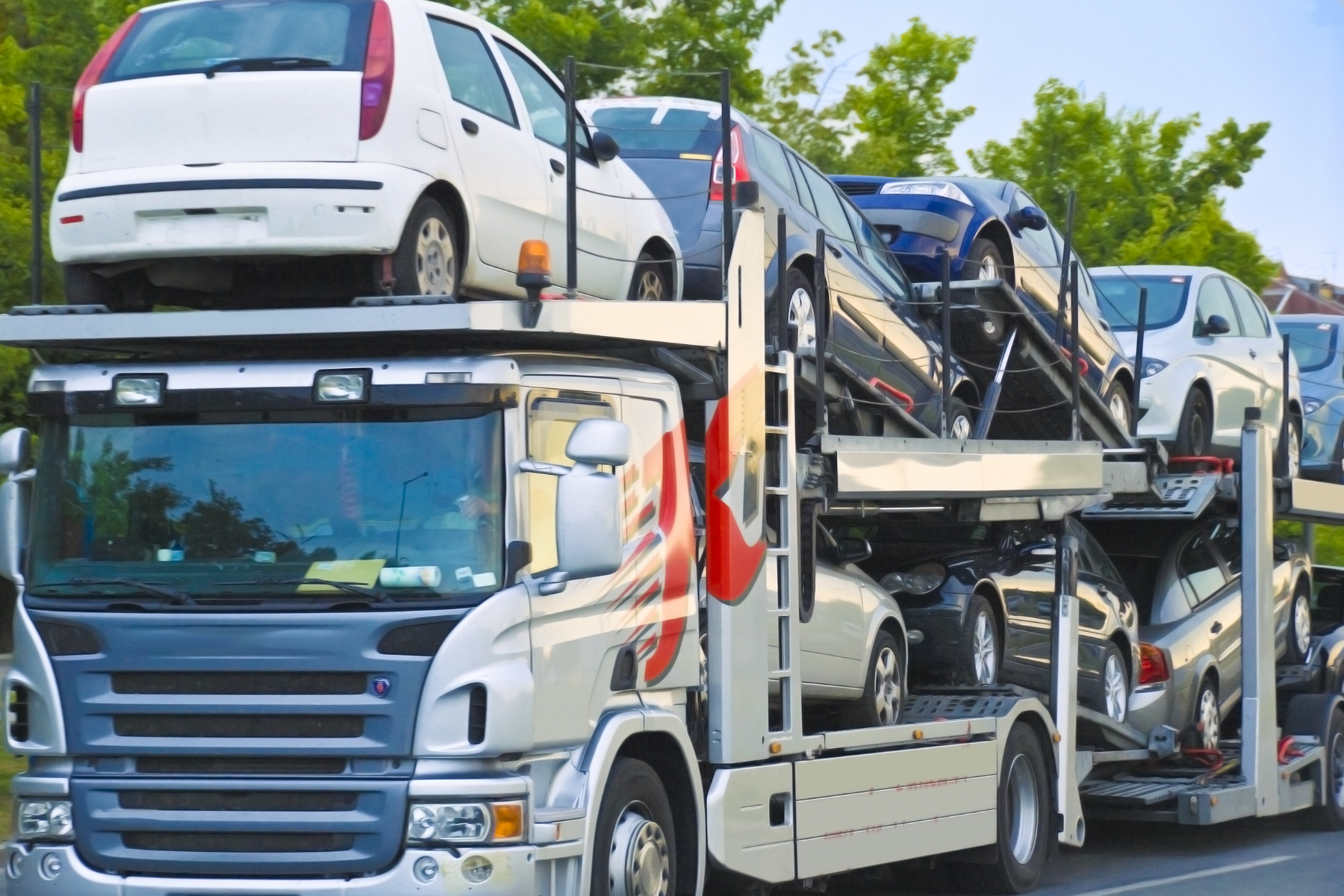 Multi-car transport truck for depot-to-depot vehicle transport