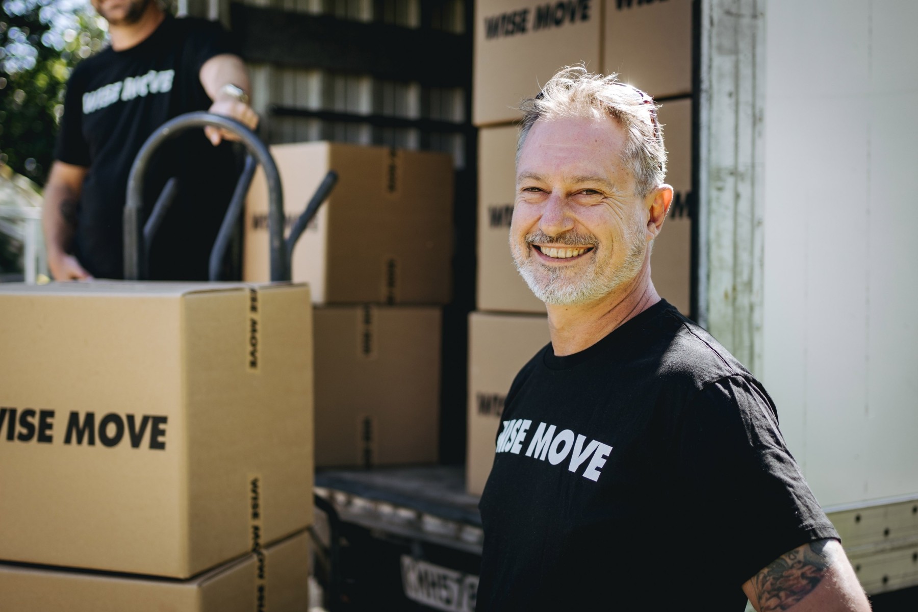 Moving team loading boxes into a truck in Tauranga