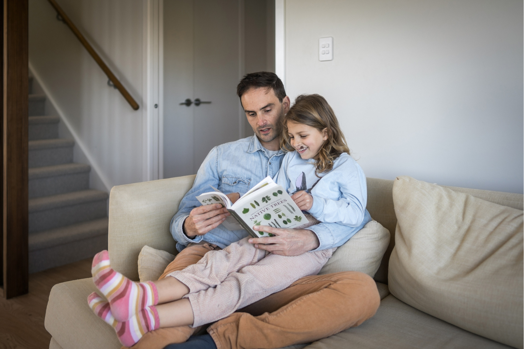 Parent reading with a child at home before starting early childhood education in New Zealand