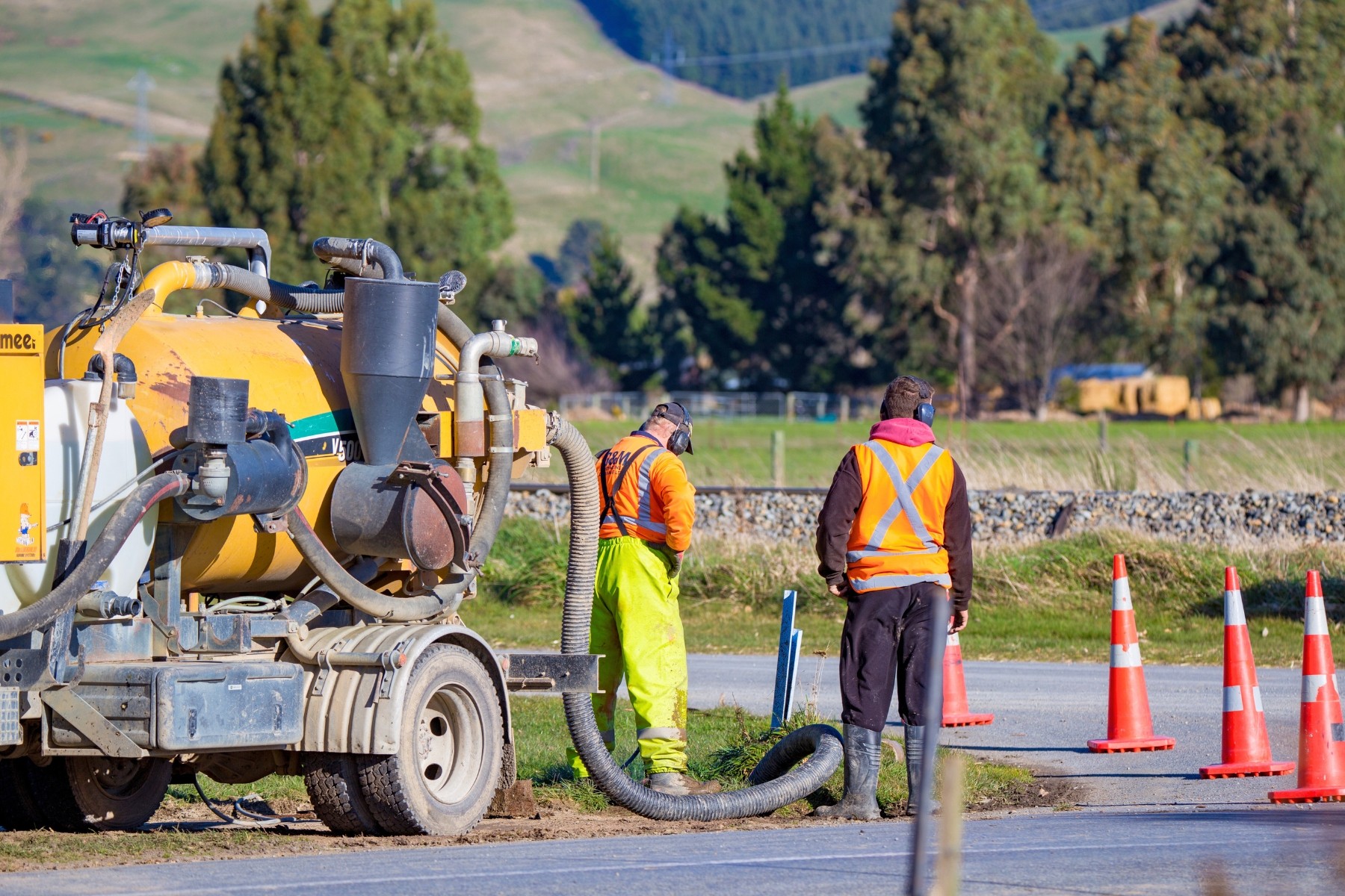 Machine operators working on road construction in Canterbury
