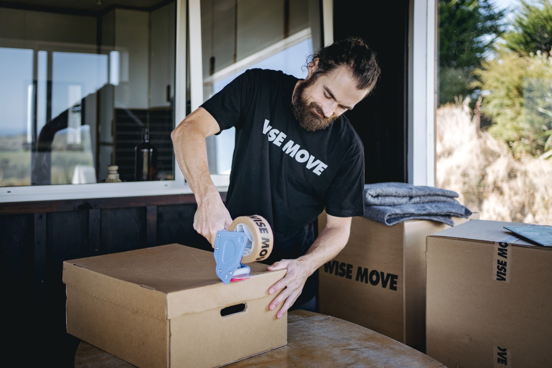 Trusted mover helping pack and load boxes for move in New Zealand