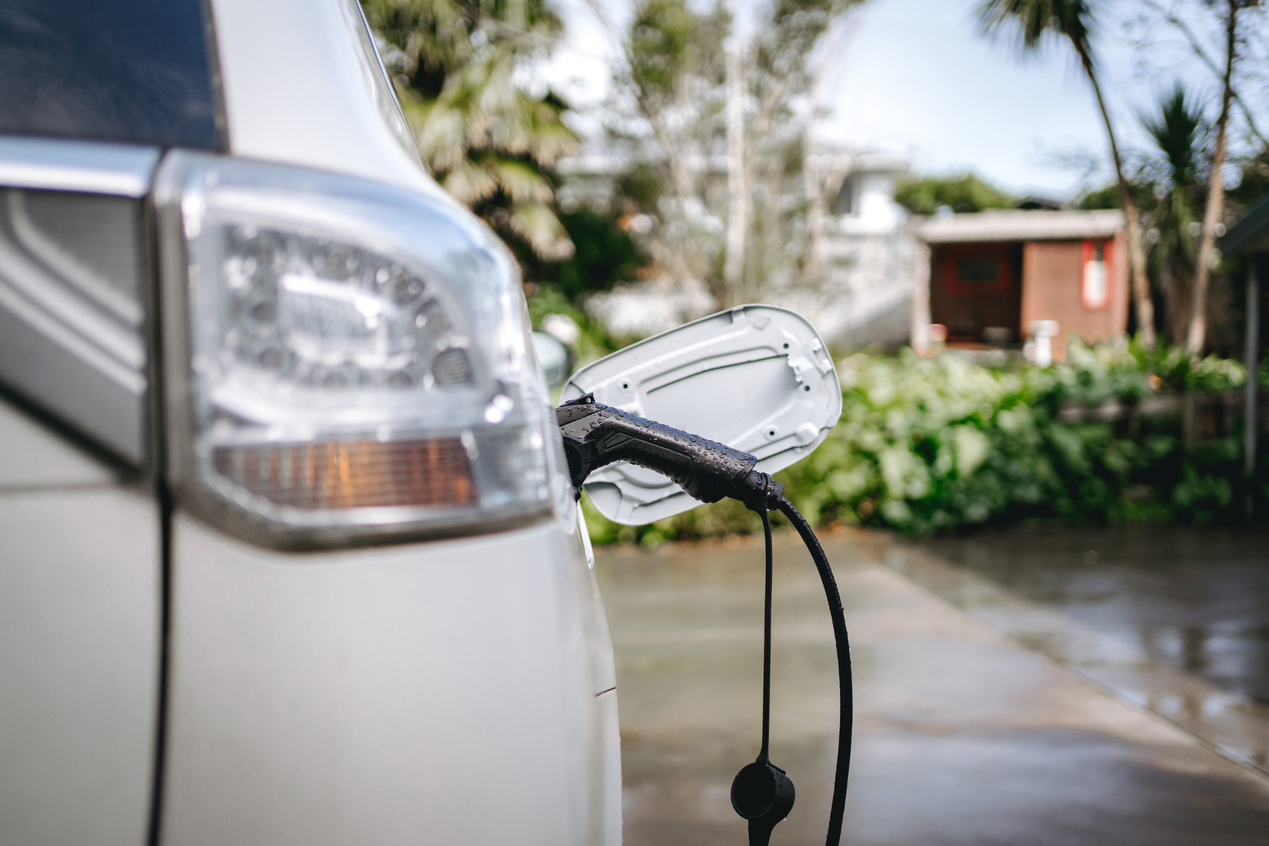 Electric car plugged in and charging in preparation for transportation