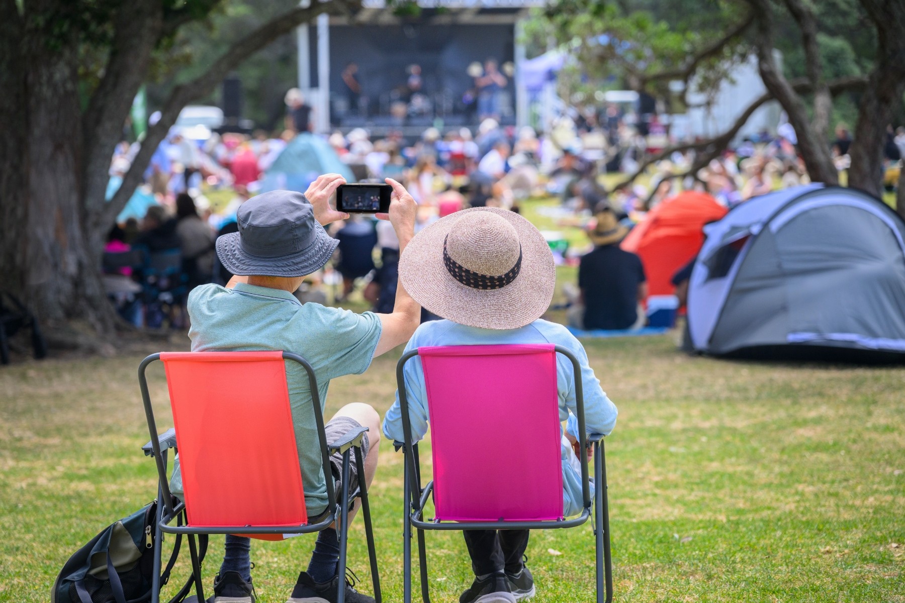 Couple at music concert taking place in an Auckland park
