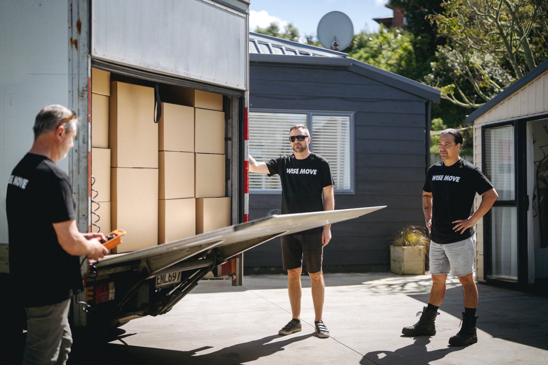 Wise Move moving team closing moving truck filled with boxes