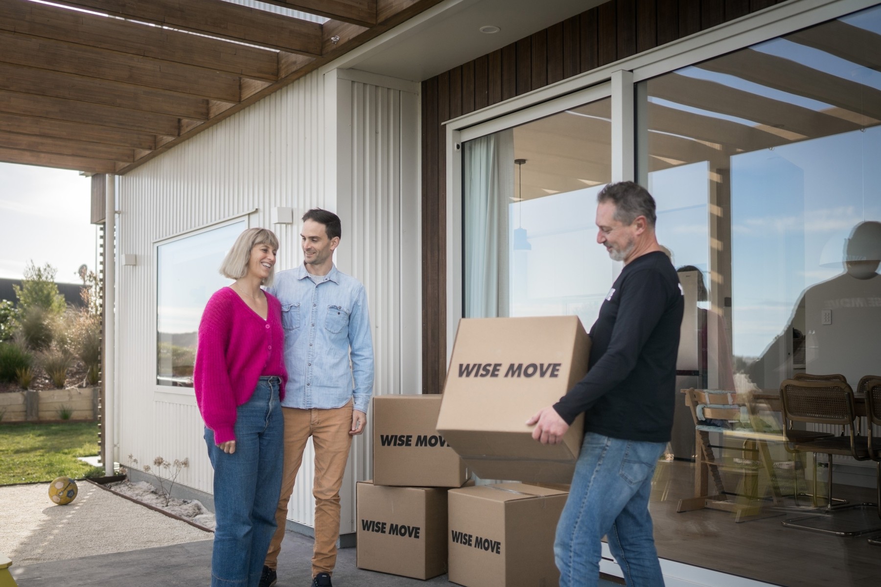 Parents speaking to moving team for family move in Wellington